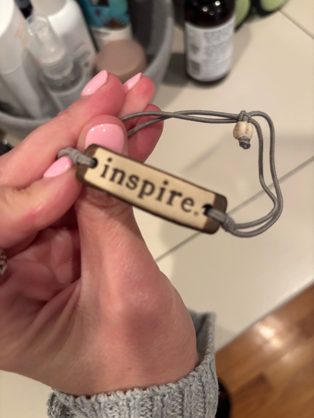 Handmade . engraved bracelet with gray cord